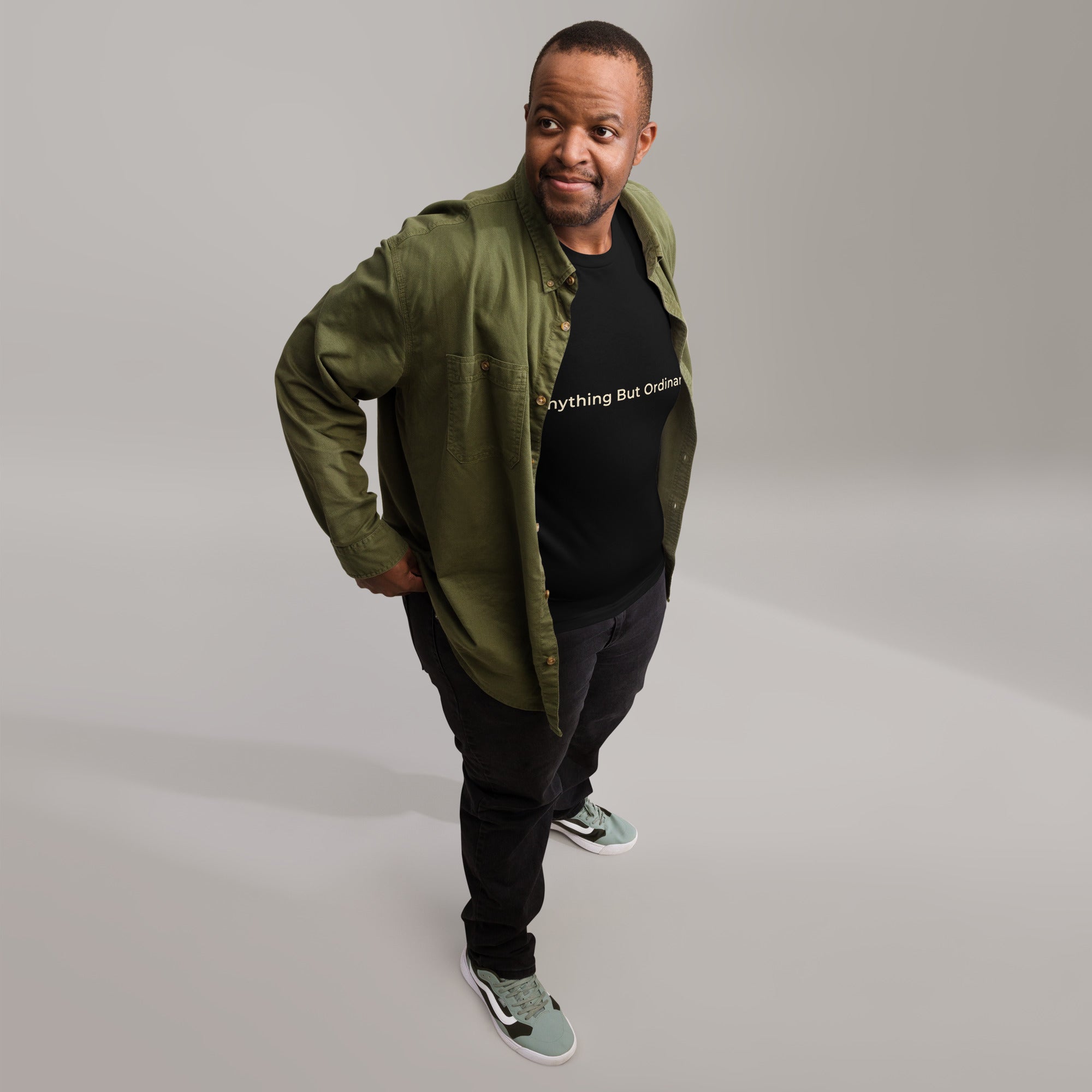 Black unisex t-shirt with the words, Anything But Ordinary on the front