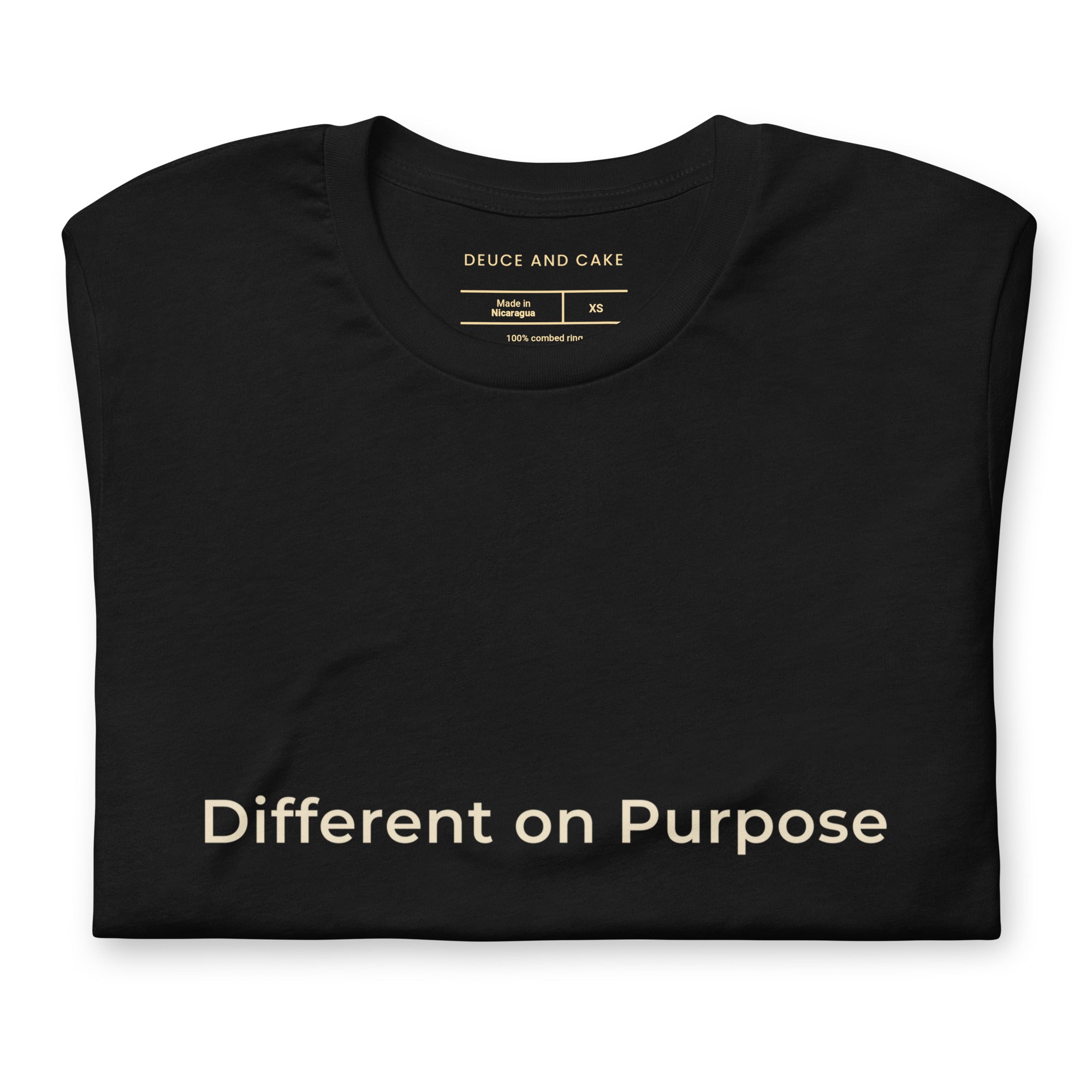 Black unisex t-shirt with the words, Different on Purpose in light gold lettering. 