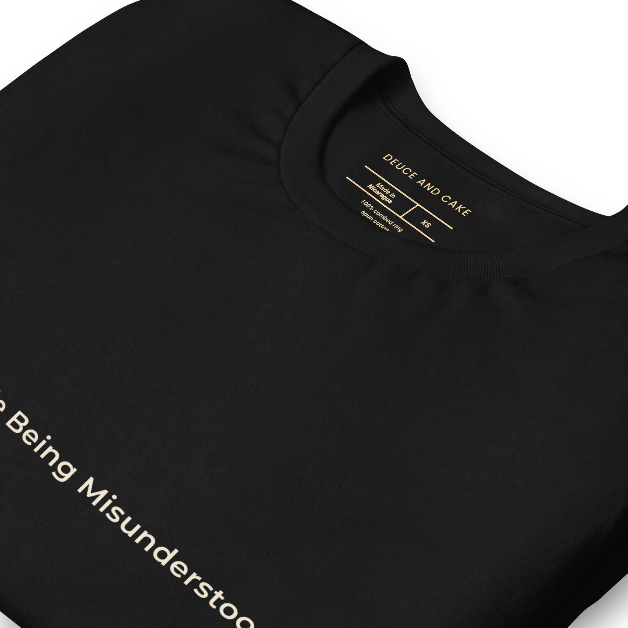 Black t-shirt with the words, Comfortable Being Misunderstood.